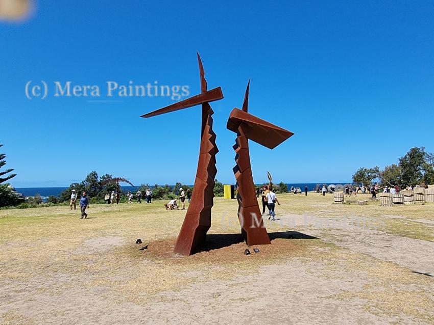 brown metal hammer type sculpture